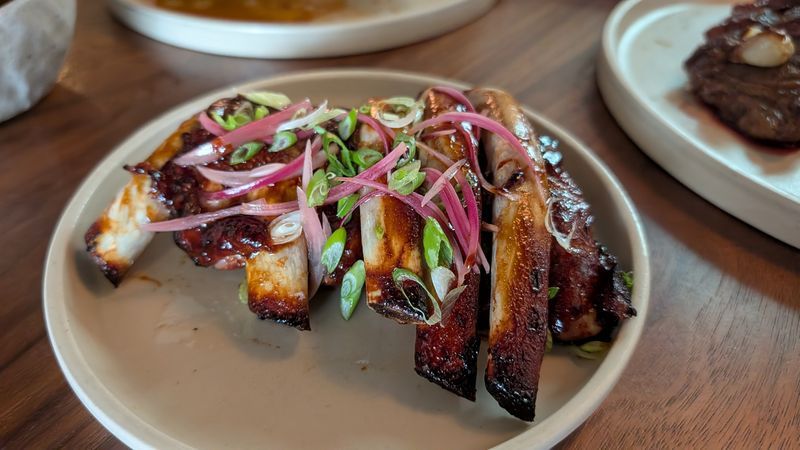 half rack of baby back ribs glazed in a cola BBQ sauce