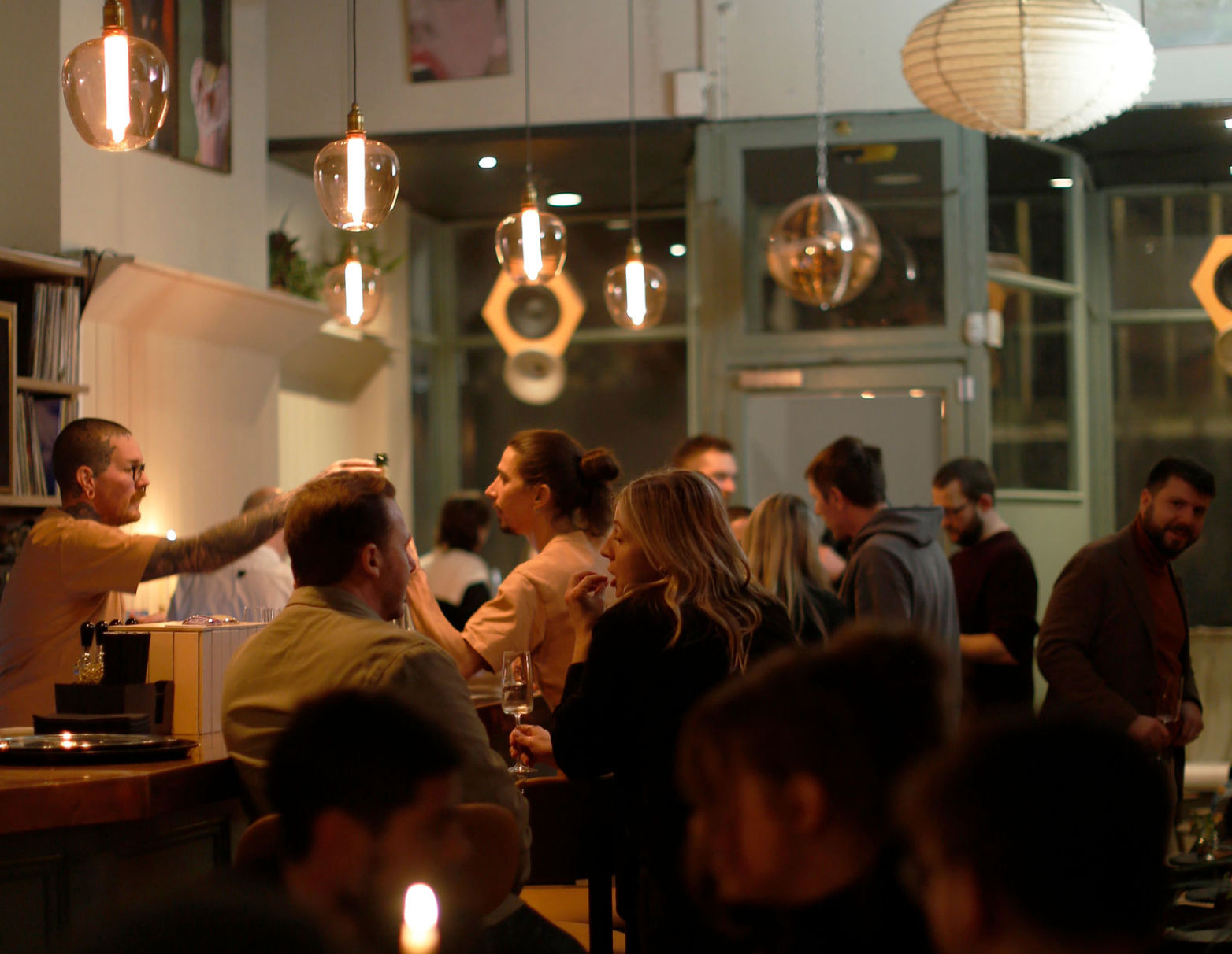 Diners sitting at the bar at Stem restaurant