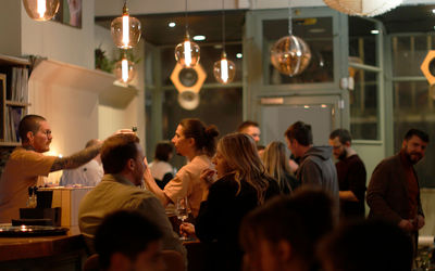 Diners sitting at the bar at Stem restaurant