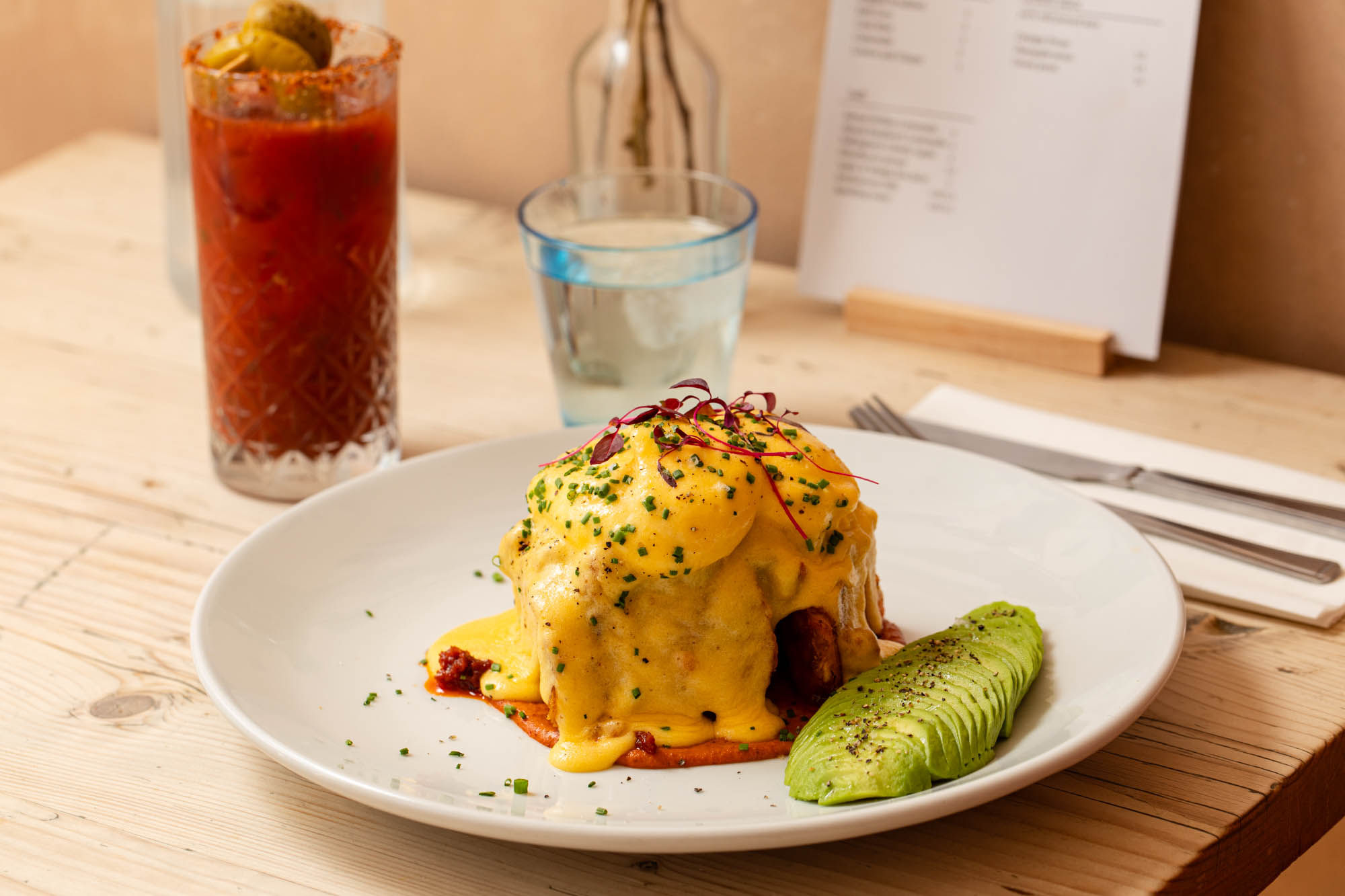 close up shot of poached egg and avocado dish at The Canopy