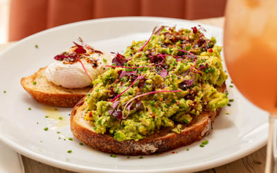 close up shot of the avocado toast served with bloody mary