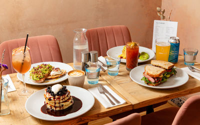 side shot of the table laid out with brunch dishes at The Canopy