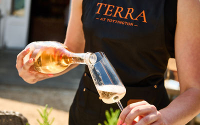 Wine being poured outside in the sunshine