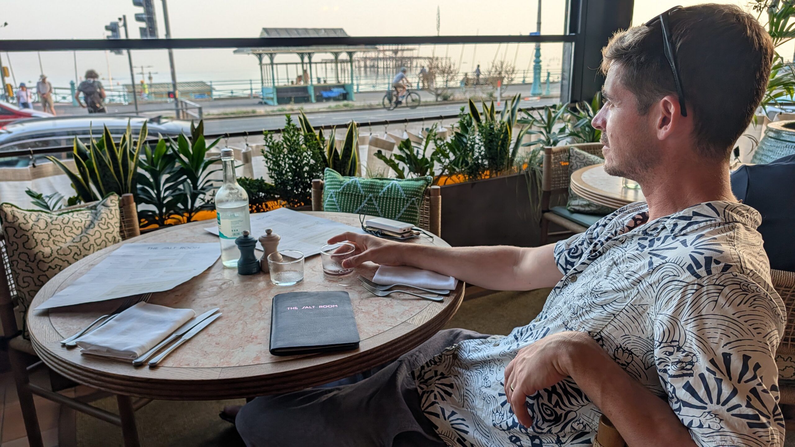 a man sitting at the outdoor table at The Salt Room Brighton