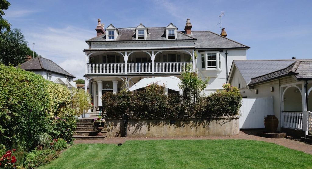 exterior shot of the Wingrove House and their beautiful garden