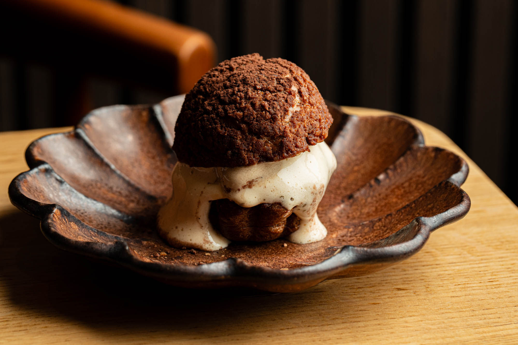 close up shot of delicious looking chocolate dessert served in shelf looking plate at Maré