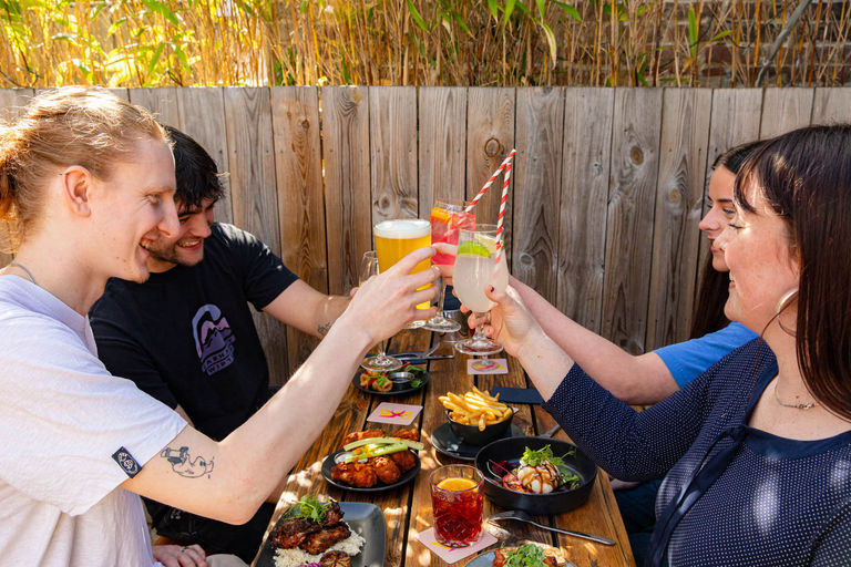People enjoying summer drinks in the beer garden with food at The Westbourne Pub