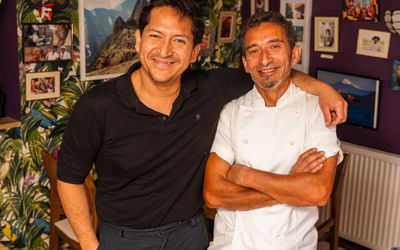 Two chefs smiling in their Brighton restaurant