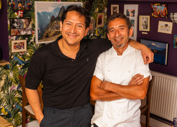 Two chefs smiling in their Brighton restaurant