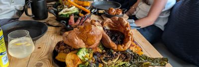 table laid out with couple of roast at Embers Brighton