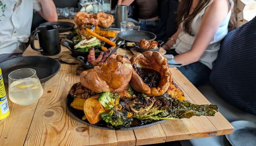 table laid out with couple of roast at Embers Brighton