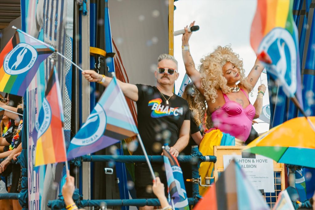 People celebrating Pride with flags