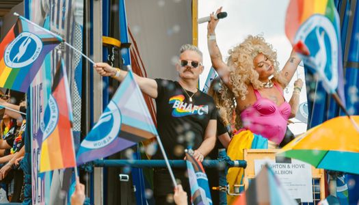 People celebrating Pride with flags