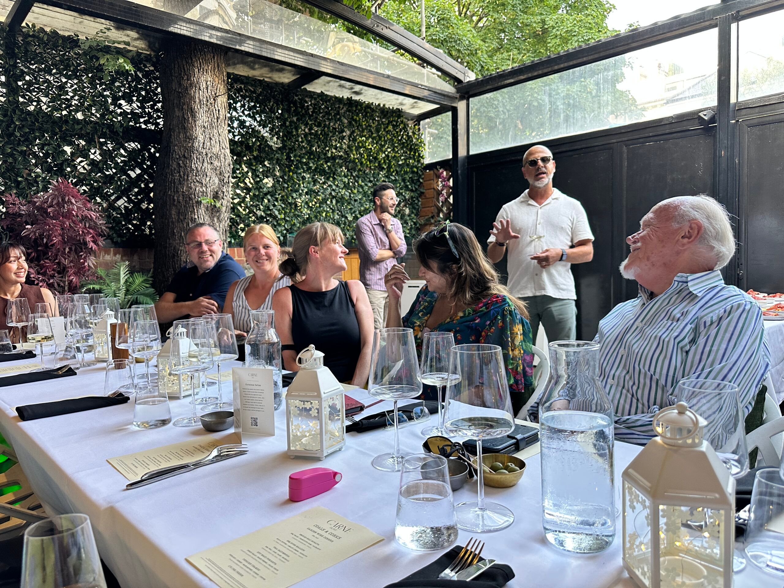 Luca speaking with event guest