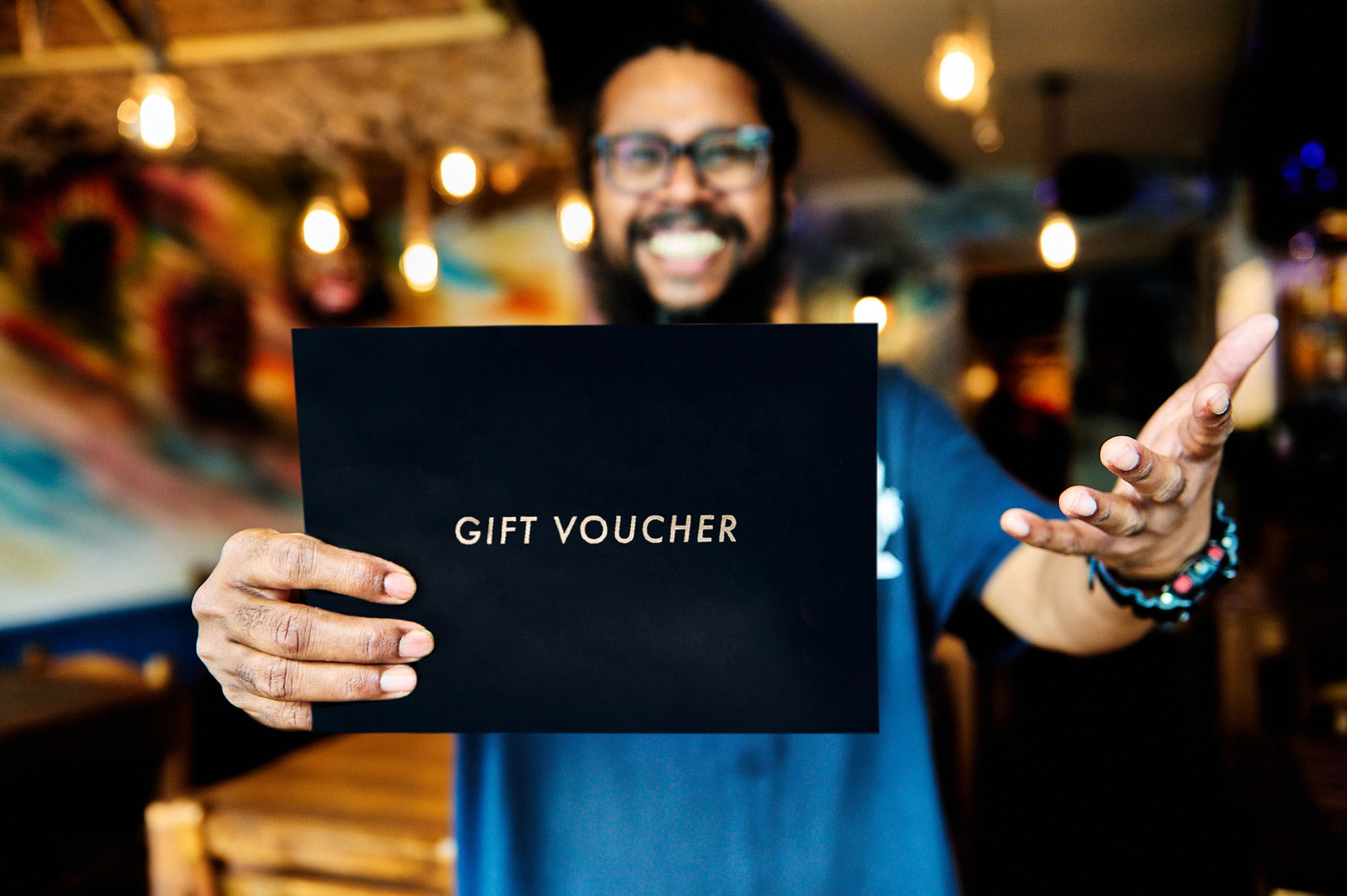 Naveen at The Coconut Island holding a Restaurants Brighton Gift Voucher
