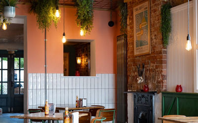 the interior wooden tables of Saltio restaurant in Worthing