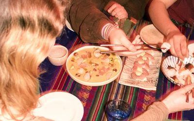 a table of diners enjoying Peruvian Food