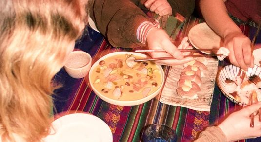 a table of diners enjoying Peruvian Food