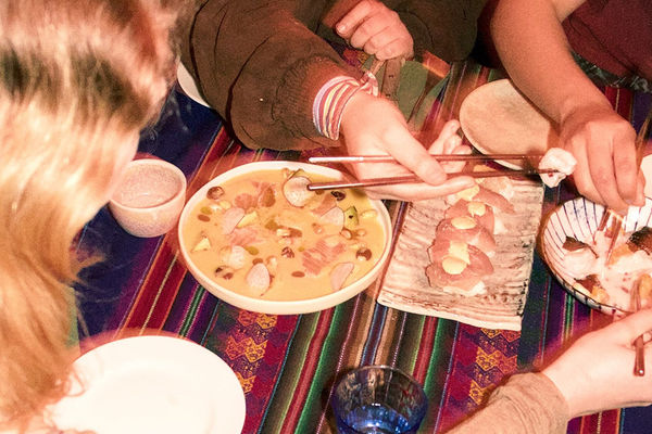 Sushi being eaten by a group of people