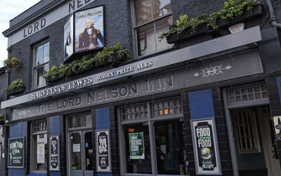 the dark blue and grey exterior of the Lord nelson in Brighton. A Harvey's pub on Trafalgar Street