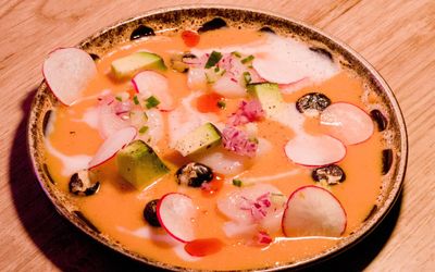 a ceviche dish - Japanese Peruvian cuisine in Brighton . A round plate beautifully decorated.