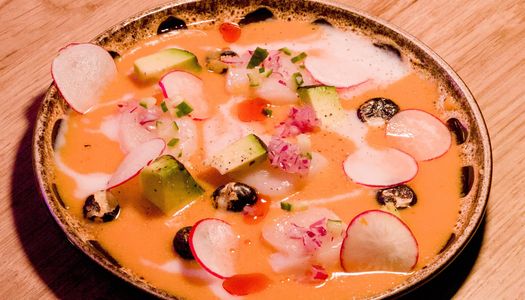 a ceviche dish - Japanese Peruvian cuisine in Brighton . A round plate beautifully decorated.