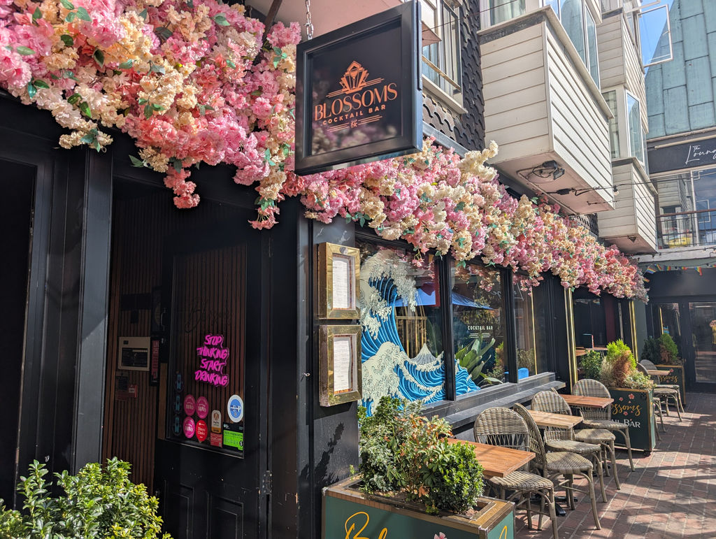 The outside of Blossoms Brighton in The Lanes with blossom adorning the entrance.