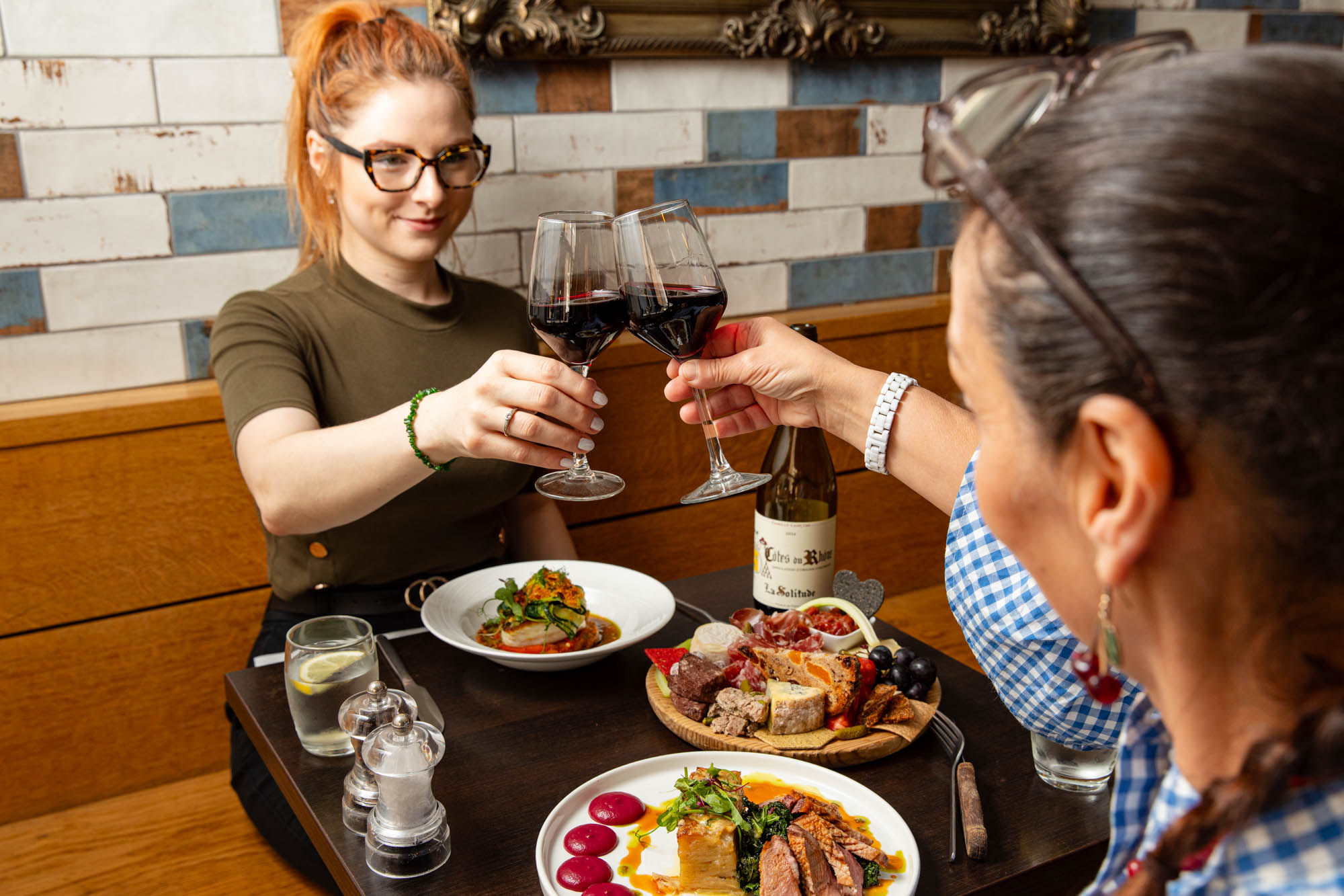 Diners enjoying the French cuisine on offer at Petit Pois 