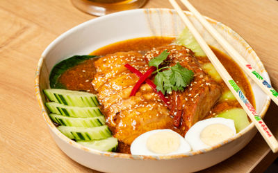 meat, eggs and veggies inside the bowl at Tamarind Brighton