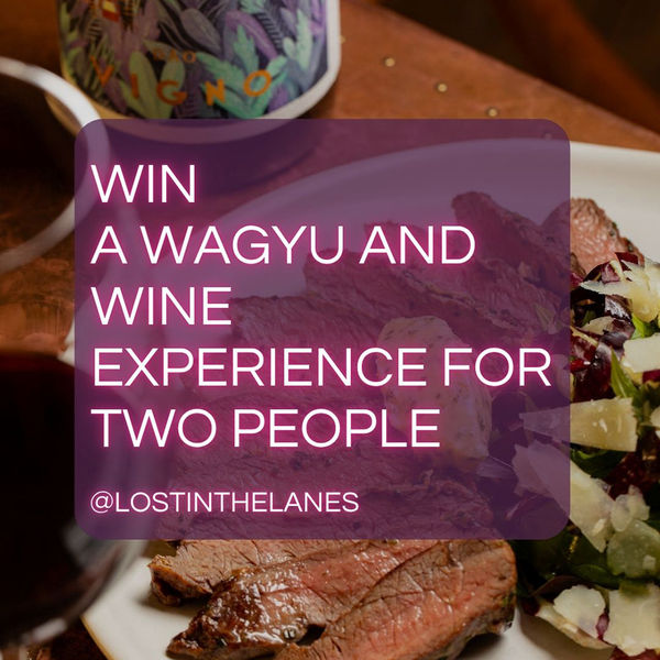 Competition graphic with purple text over a background photo with steak and a bottle of wine