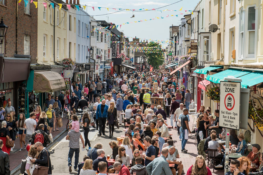 A photograph of a busy street in Brighton's North Laine on a sunny day