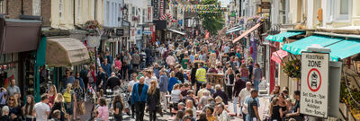 A photograph of a busy street in Brighton's North Laine on a sunny day