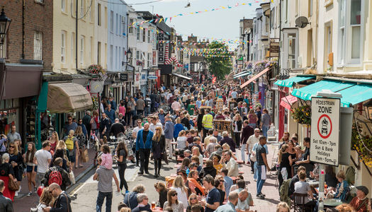 A photograph of a busy street in Brighton's North Laine on a sunny day