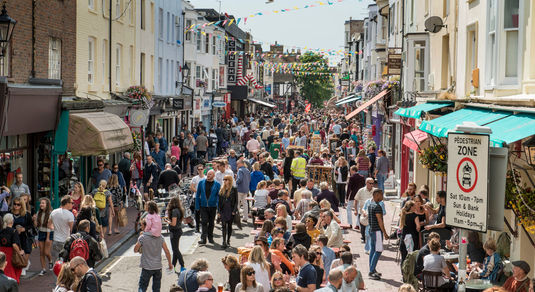 A photograph of a busy street in Brighton's North Laine on a sunny day