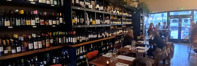 interior shot of fourth and church showcasing their wine shelves and tables