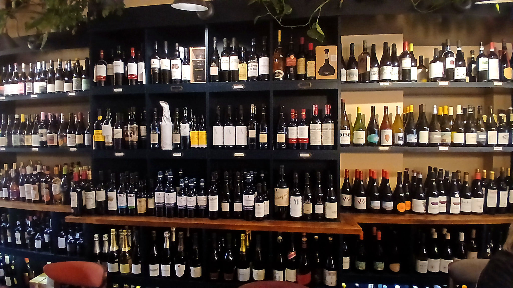 shelves of wine at the wine bar Fourth and Church
