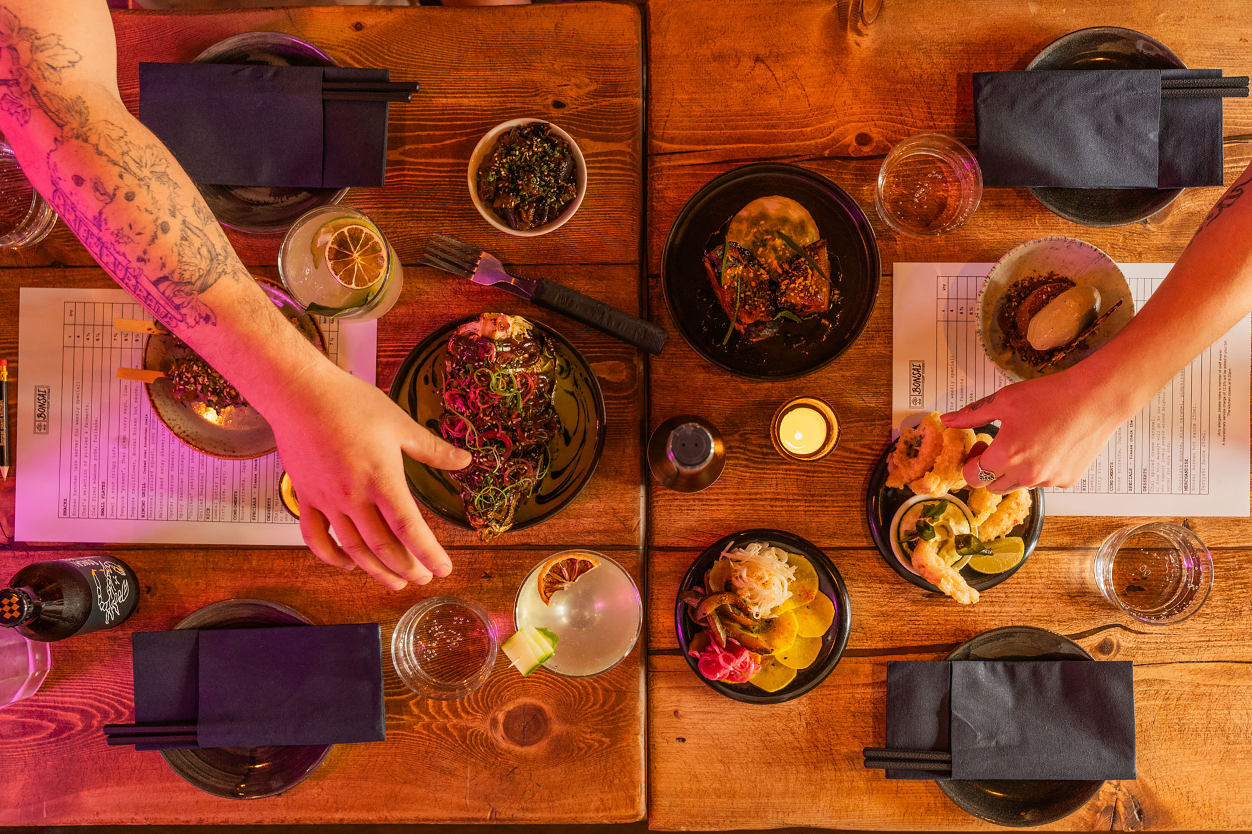 over head shot of table laid out with dishes and drinks at Bonsai Plant Kitchen