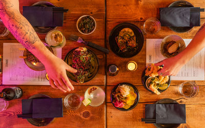 over head shot of table laid out with dishes and drinks at Bonsai Plant Kitchen