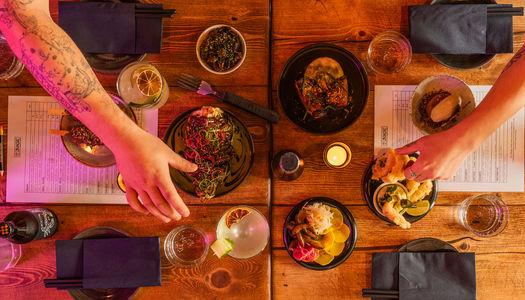 over head shot of table laid out with dishes and drinks at Bonsai Plant Kitchen